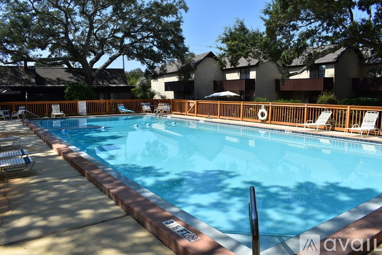 A pool with a brown border and a lifebuoy in the middle.