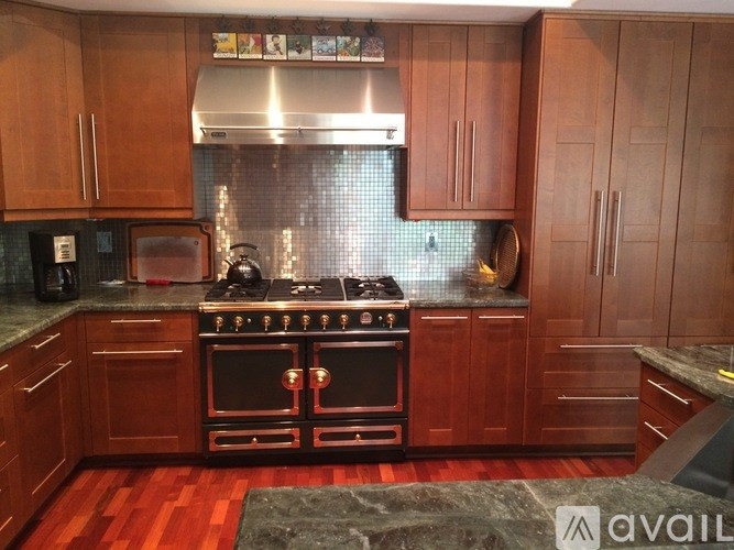 A kitchen with a stove top oven and a microwave.