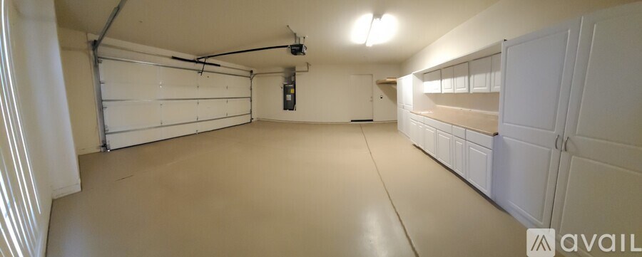 A bathroom with a toilet, sink, and shower.