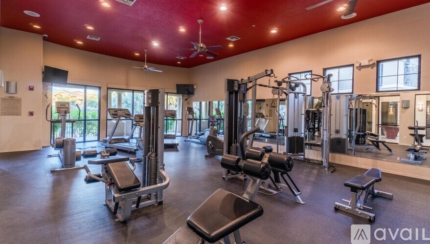 A well-equipped gym with a variety of machines and weightlifting equipment.
