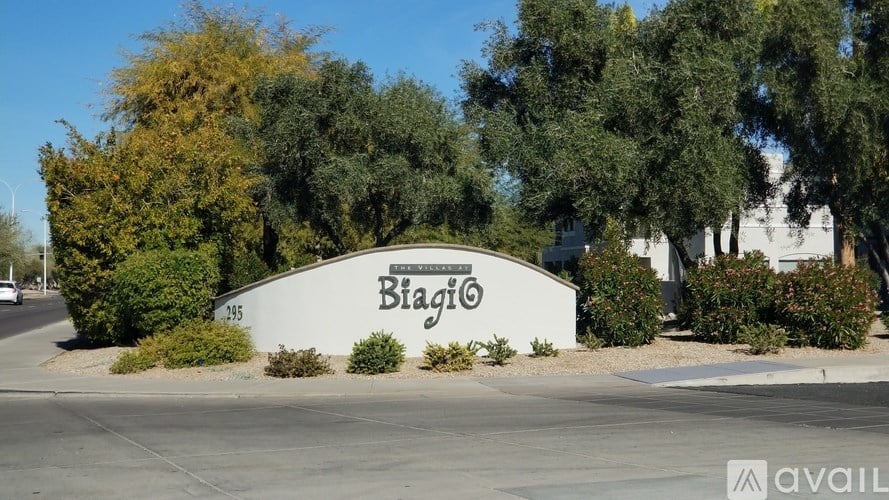 A white sign with the word "Biaigio" on it is surrounded by greenery.