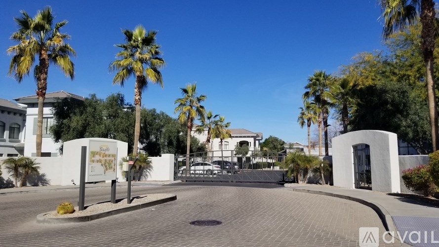 A sign that says "AVAIL" is in front of a white gate.