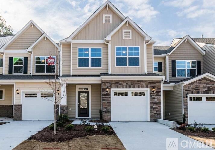 A house with a garage is for sale.