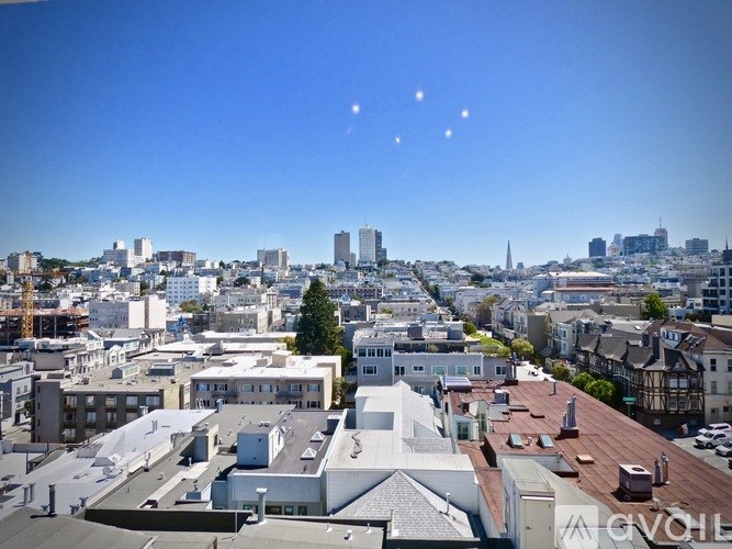 A cityscape with buildings and a clear sky.
