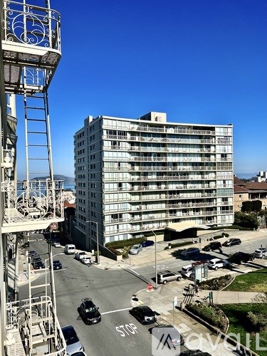 A tall building with a blue sky in the background.
