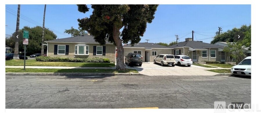 A house with a tree in front of it.