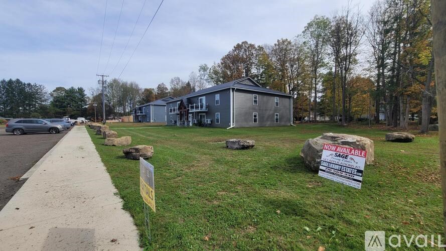 A sign in front of a house says "NOT AVAILABLE".