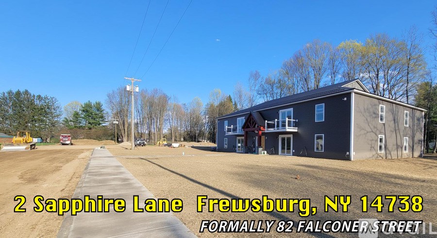 A construction site with a building and a sign that says "2 Sapphire Lane Frewsburg, NY 14738 FORMALLY 82 FALCONER STREET".