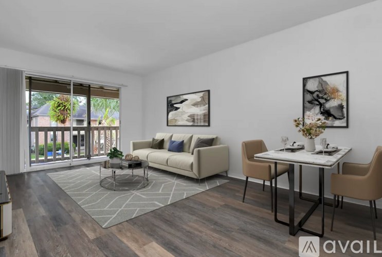 A living room with a sofa, chairs, and a coffee table.