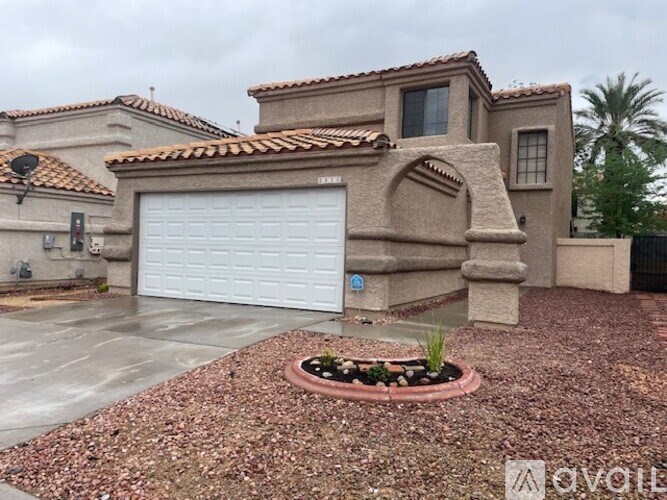 A house with a white garage door and a brown roof.