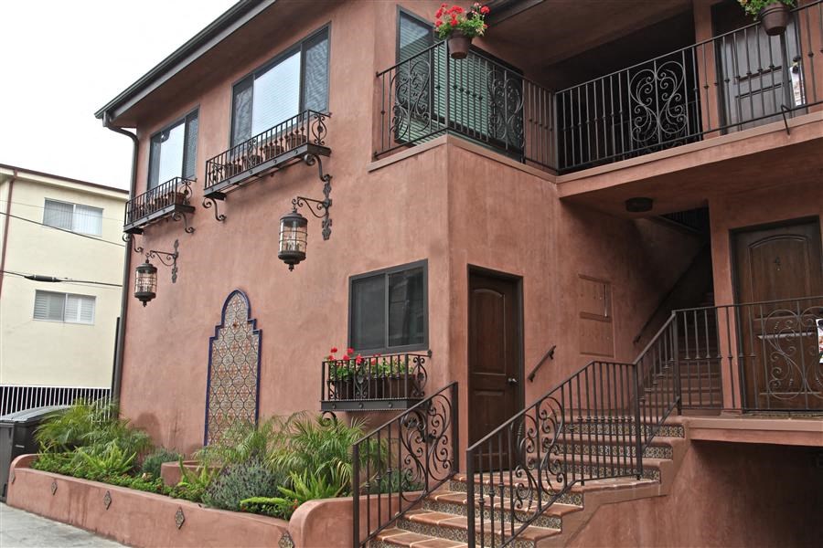 a building with stairs and balconies on it