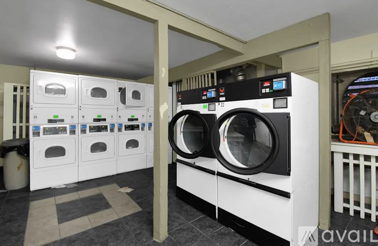 A row of washing machines in a public laundromat.