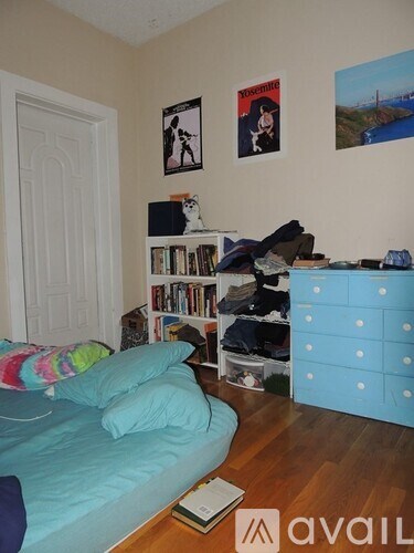 A room with a bed, a bookshelf, and a dresser.