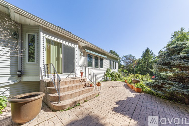 A house with a patio and a planter.