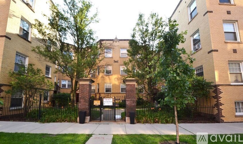 A brick building with a gate in front of it.