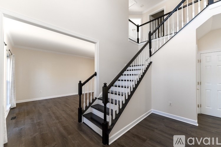 A black and white staircase in a house.