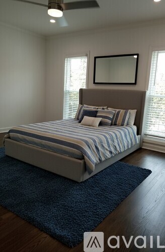 A bathroom with a vanity, two sinks, and a mirror.