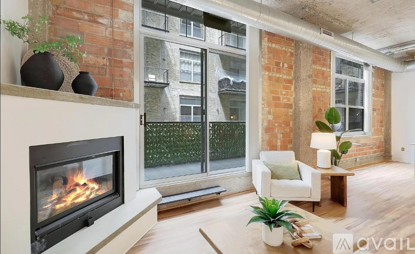 A living room with a fireplace and a couch.