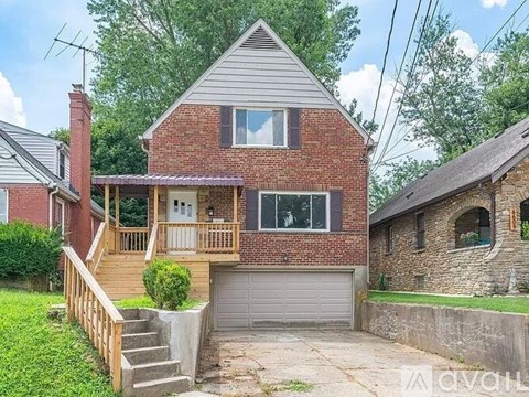 A room with wooden flooring and a ceiling fan.