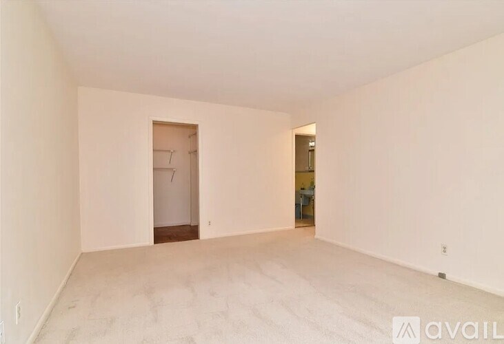 A room with a doorway leading to another room.