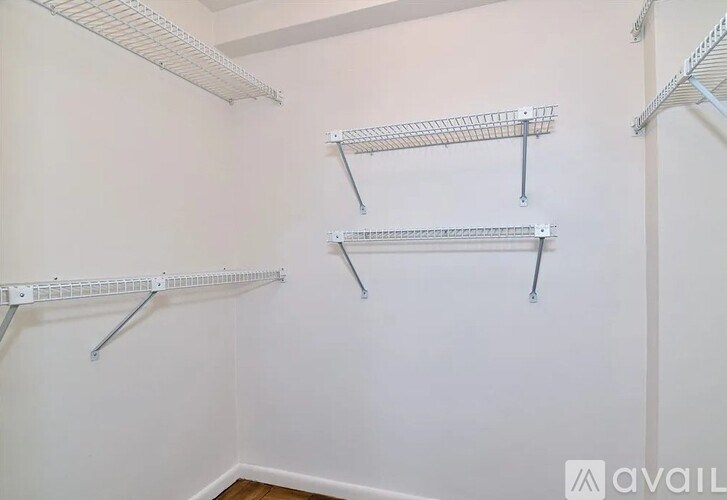 Empty shelves in a room with white walls.