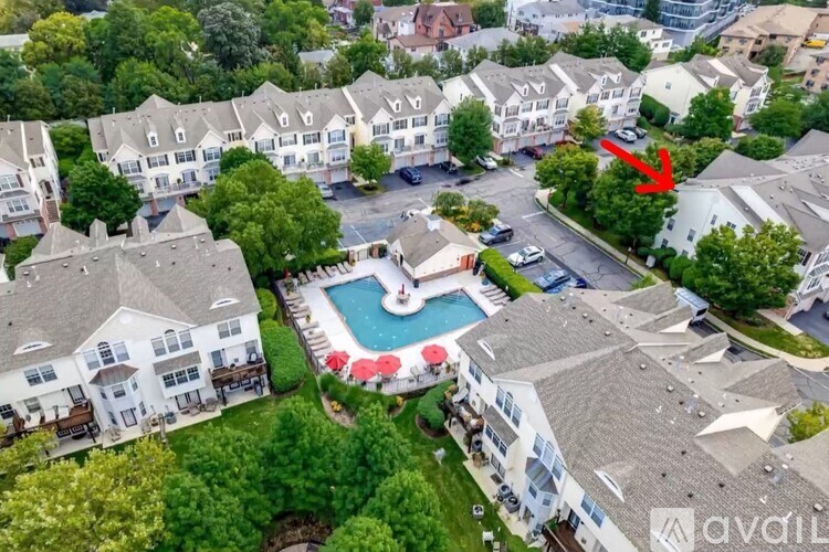 A red arrow points to a house with a pool in the middle of a neighborhood.