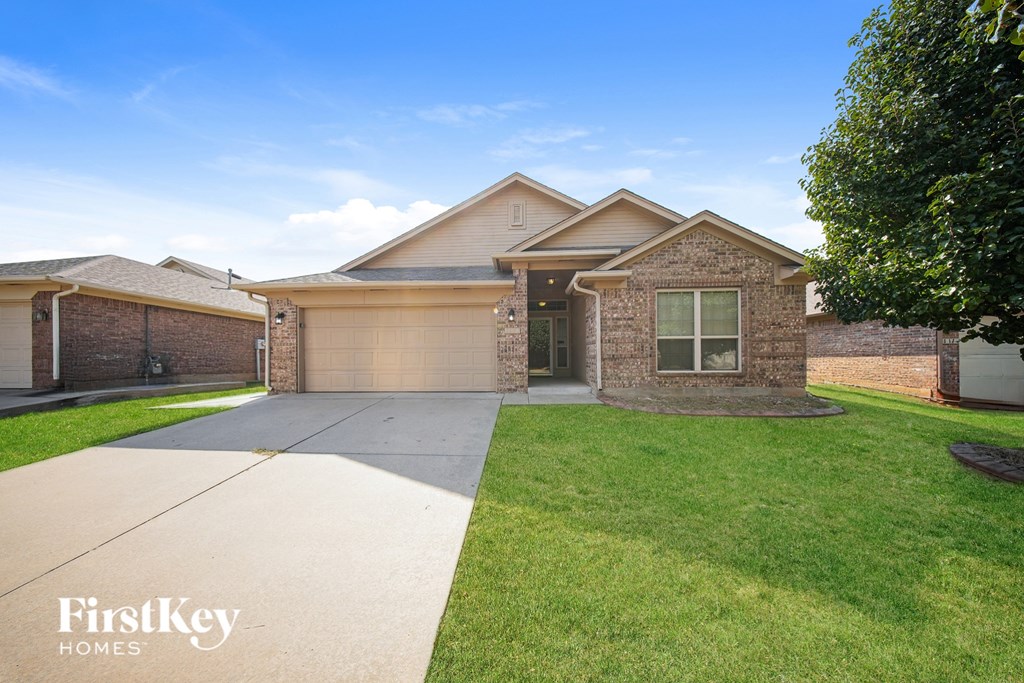 A house with a garage is for sale by FirstKey Homes.