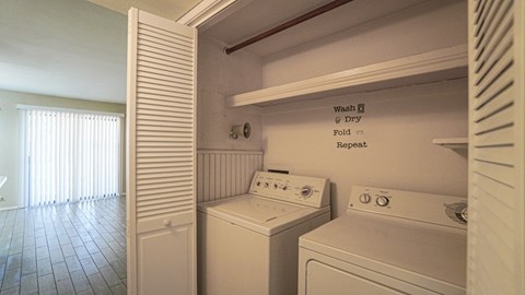 A laundry room with a washer and dryer.
