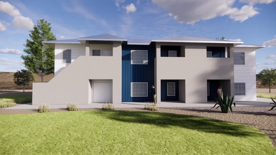 A modern house with a blue door and windows.