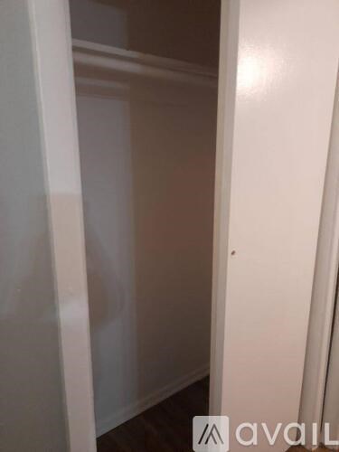 A white door with a small hole in the middle.