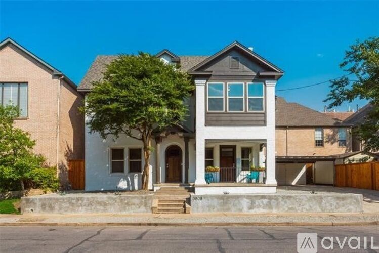 A house with a blue front door is for sale.