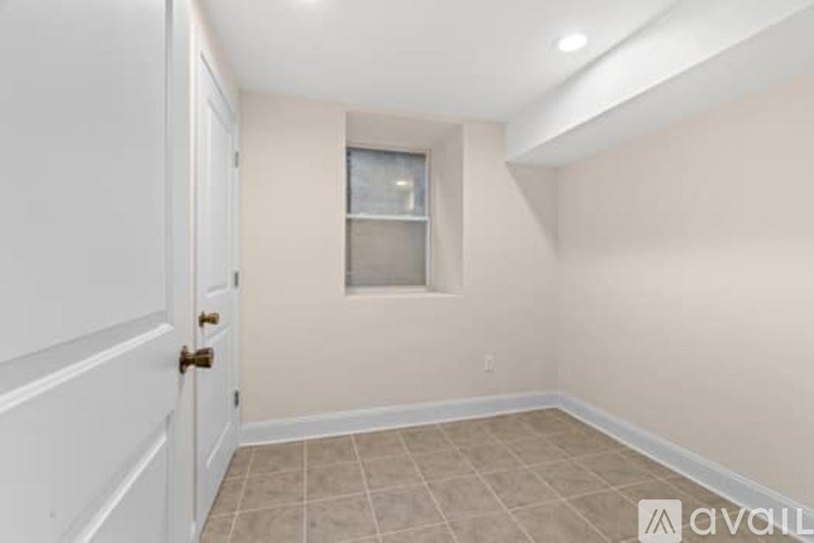 A room with a door and a window.