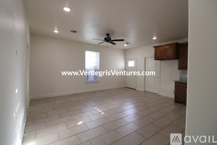 A room with a ceiling fan and tiled flooring is available for rent.