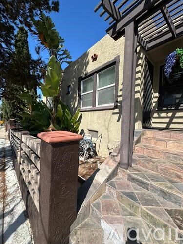 A house with a brown fence and a window.