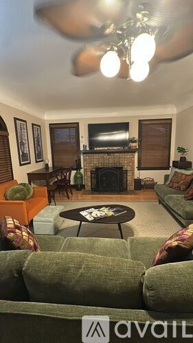 A living room with a fireplace and a couch.