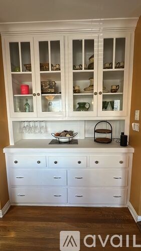 A kitchen with white cabinets and drawers is on the market.