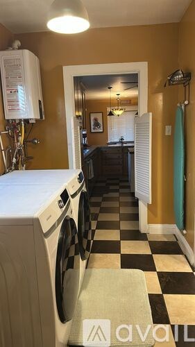 A laundry room with a washer and dryer.