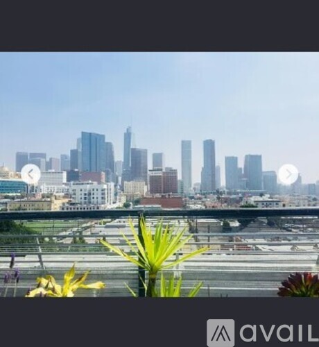 A city skyline with tall buildings and a clear sky.