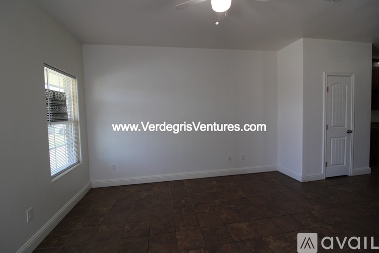 A room with a VerdeGisVentures.com sign on the wall.