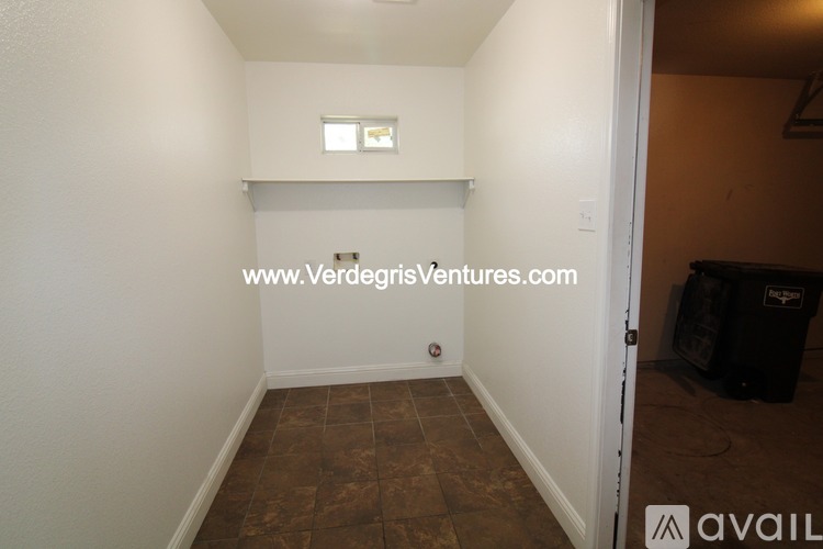 A room with a website address on the wall.