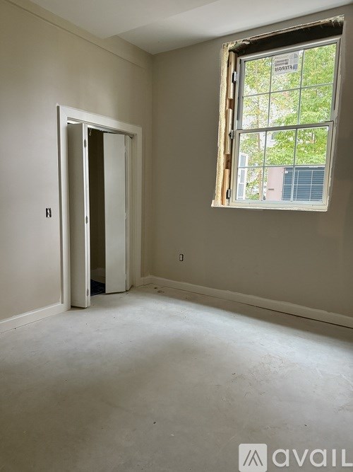 A room with a door and a window.