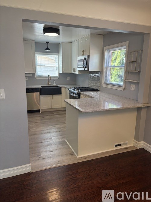 A kitchen with a large island in the middle.