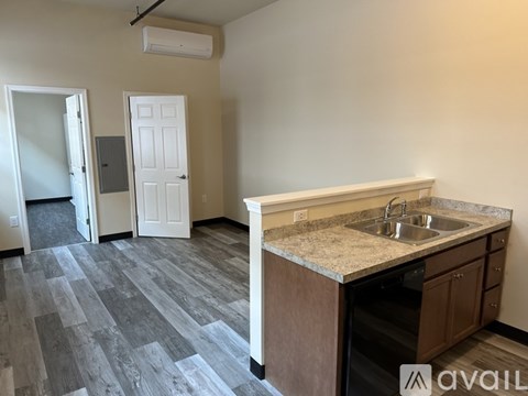 A kitchen with a sink and cabinets.