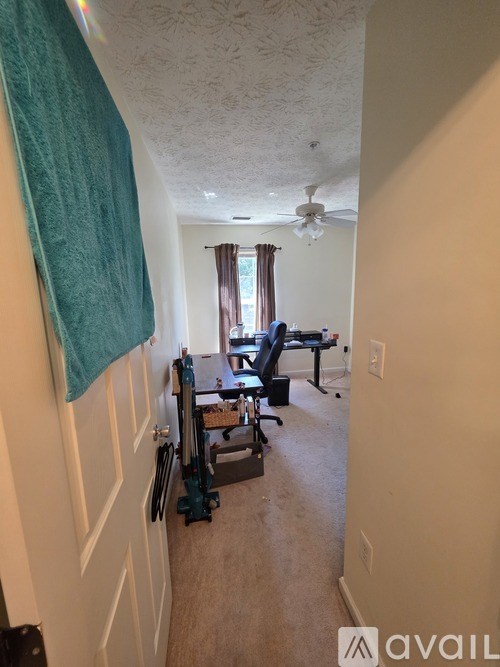 A room with a desk and a chair.