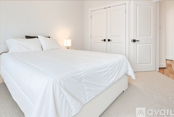 A patio with a table and chairs under an umbrella.