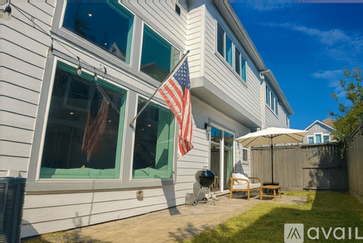 A house with an American flag hanging outside.