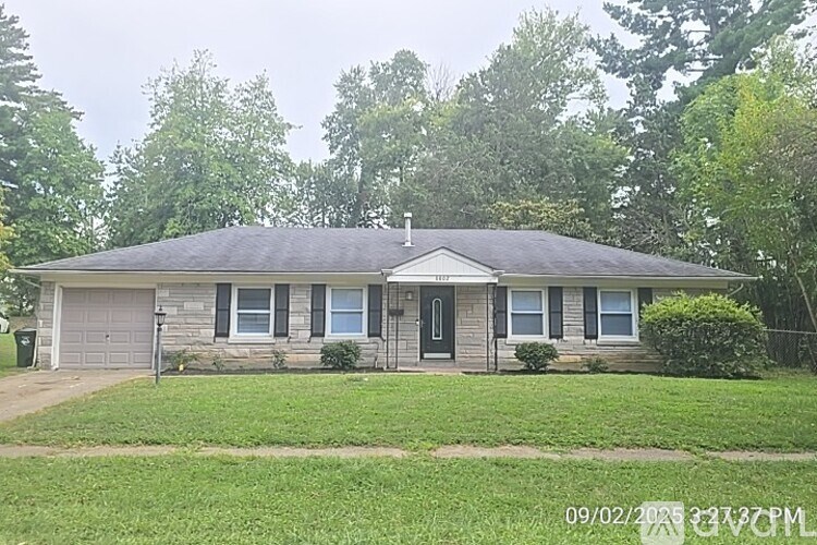 A house with a grey roof and a grey garage door.