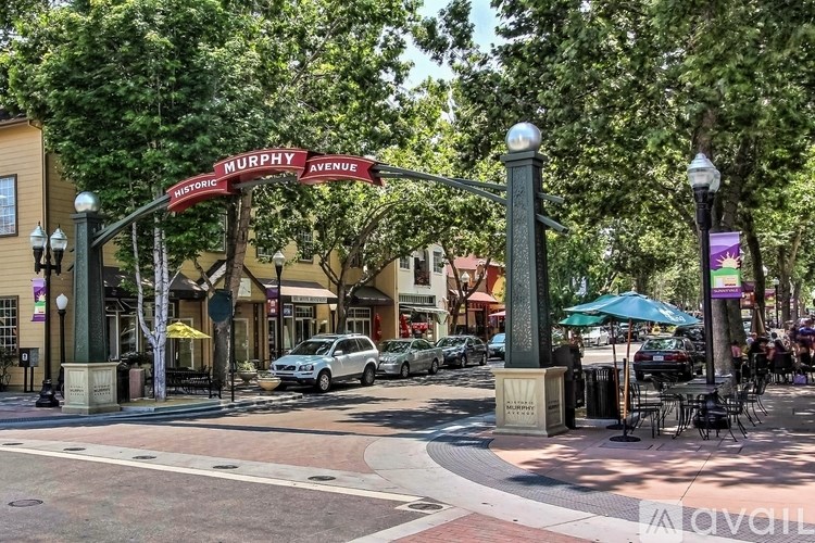 A street view of Murphy Avenue with cars parked on the side of the road.
