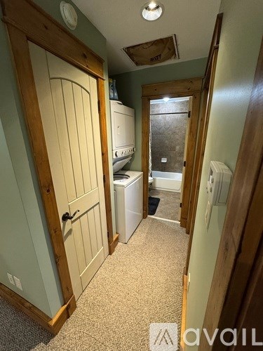 A laval washing machine is in a small room.