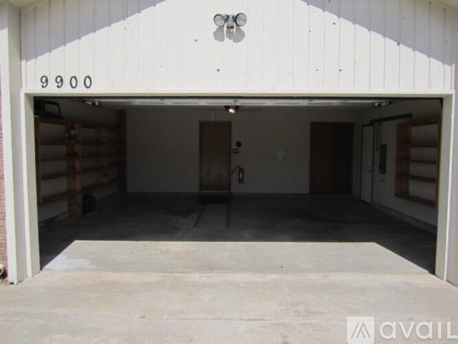 A large garage with the number 9900 on the wall.